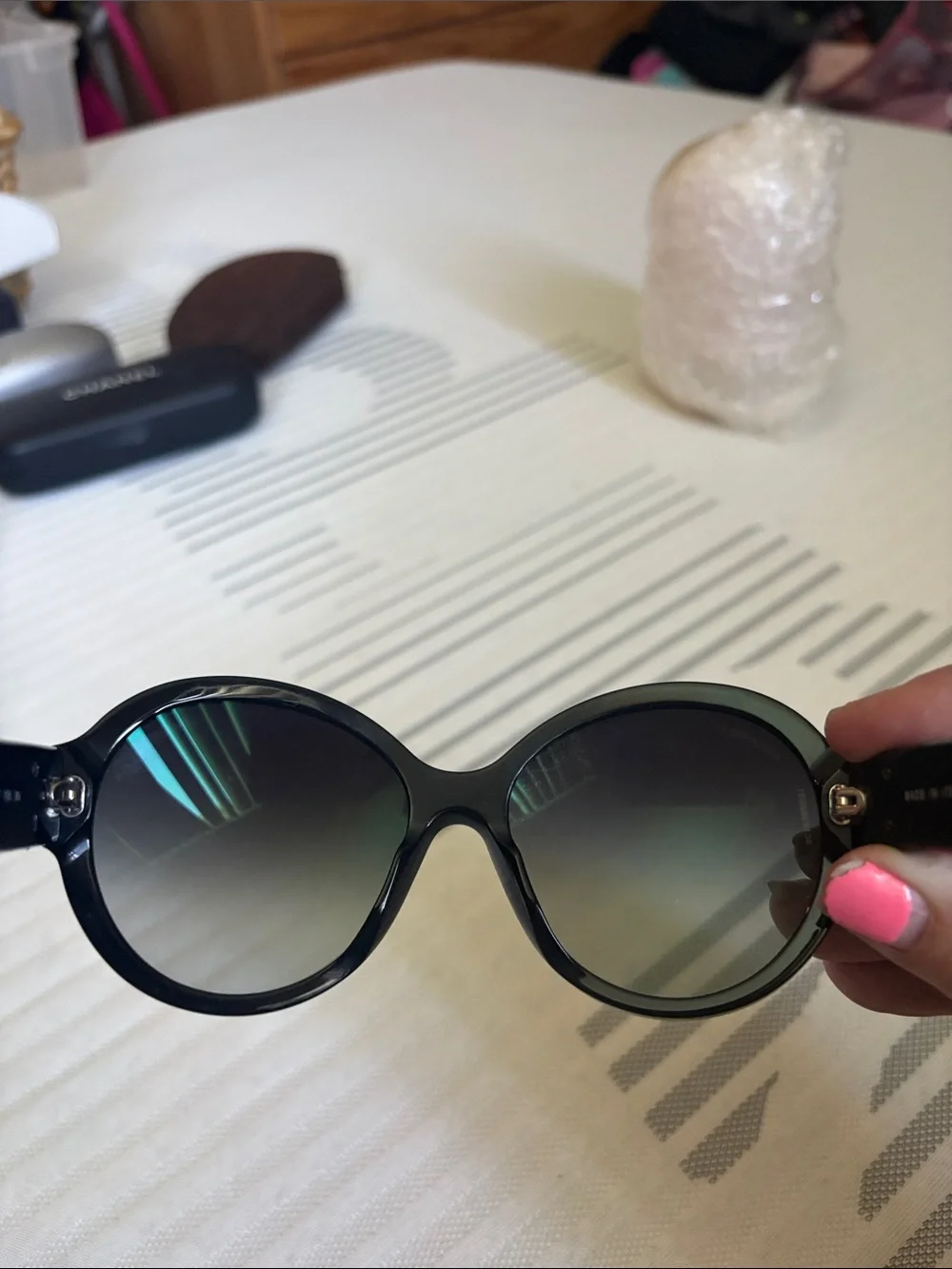 CHANEL Black Oversized Round Women's Sunglasses with iconic bows on each side.
